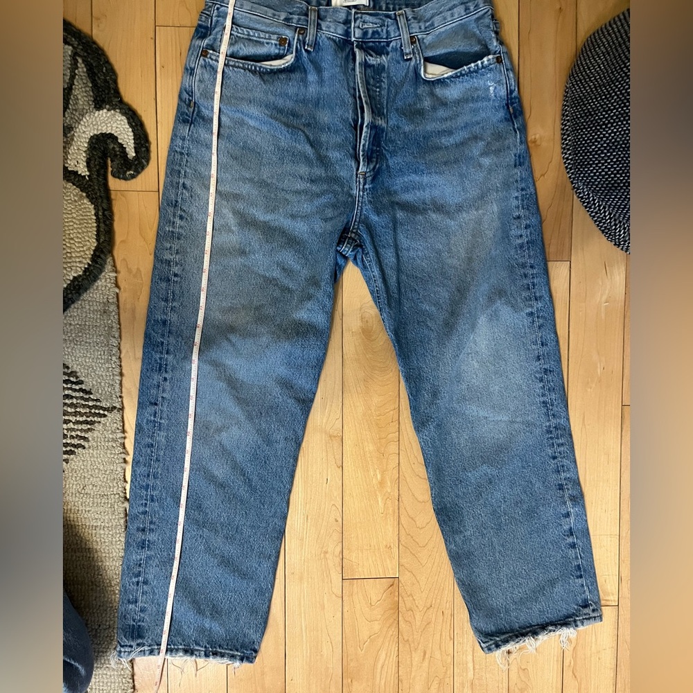 Agolde size 28, button fly, blue jeans, frays at ankles.